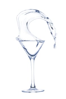 Freakish splashes transparent at its finest from a glass for martini close up.
