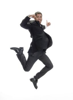 businessman leaps in air on an isolated background