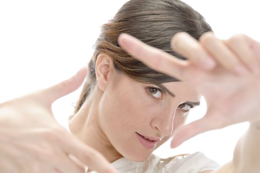 woman showing framing hand gesture on an isolated background