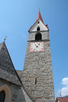 bell tower of a church in alpes