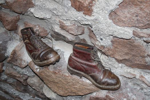 old climbing shoes in the museum of saint firmiano