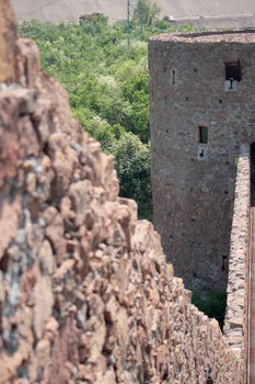 rocks wall of the castle of saint firmiano