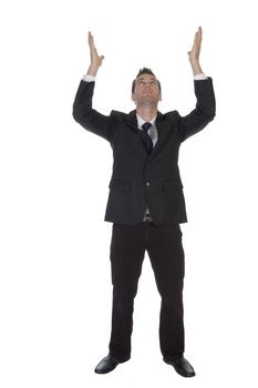 man making wish with raised hands against white background