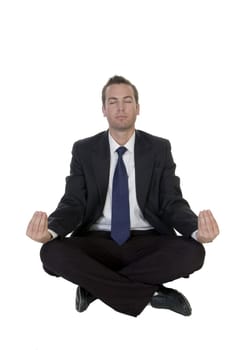 businessman doing meditation on white background