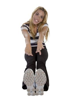 blonde lady stretching her hads and feet on an isolated background