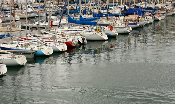 Tall luxury boats and yachts moored in duquesa Port In Spain. Barcelona