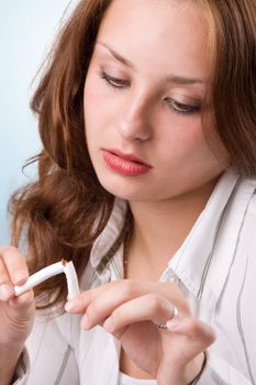 Portrait of beautiful girl breaking cigarette. #3