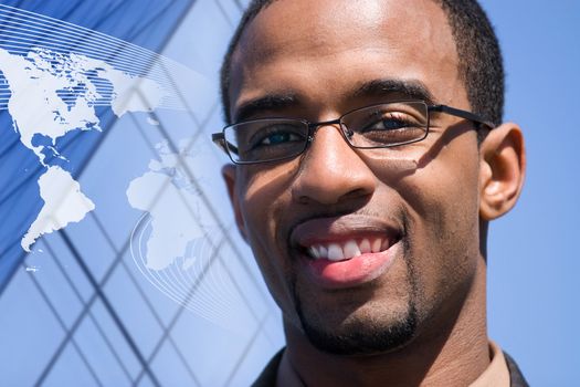 A smiling African American man over a world map conceptual background.