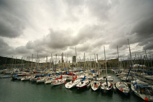 Tall luxury boats and yachts moored in duquesa Port In Spain. Barcelona