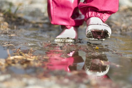 Child walking in water on rainy day!