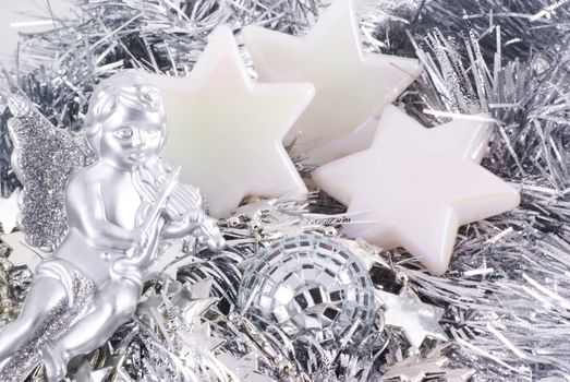 Close up of different kinds of silver christmas ornaments.          