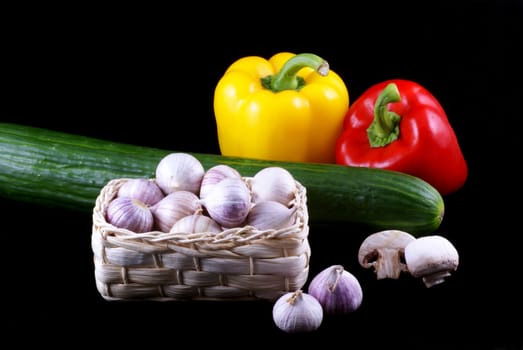 Different kinds of vegetables isolated on a black background.