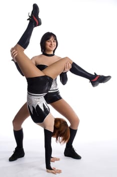 two dancers in same costumes on white

