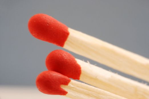 Close up of three red wooden matches