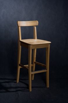 wooden lacquered chair on black
