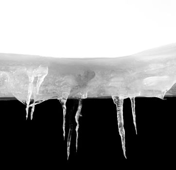  Ice stalactites on the side of a roof