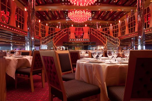 A empty dining room decorated in red fabric