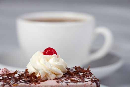 cherry cake and a cup of coffee