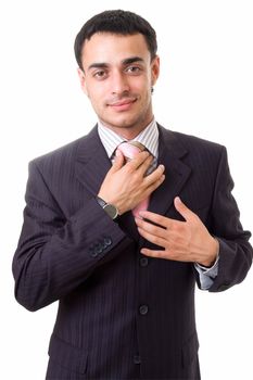 young businessman with beard adjusting his tie