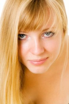 Portrait of the smiling young woman. The beautiful face close up.