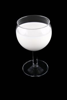 glass of milk isolated on black background