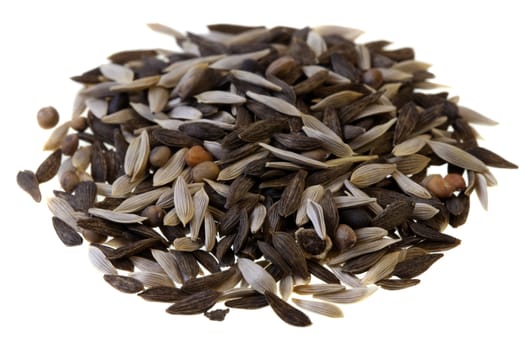 a pile of tiny seeds of lettuce, chicory, endive and spinach (several species) to be planted and grow for baby leaves salad, isolated on white