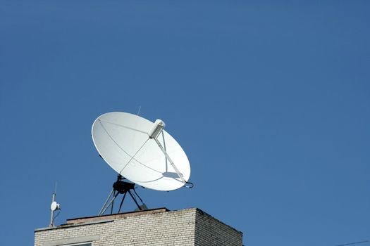 Dish aerial antenna on the blue sky background 2