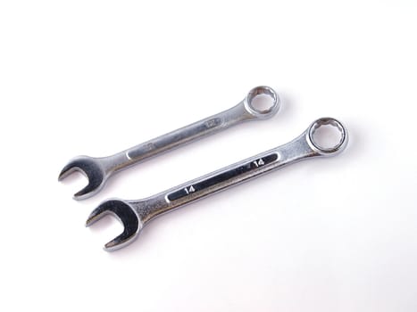 Two chrome spanners on a white background.