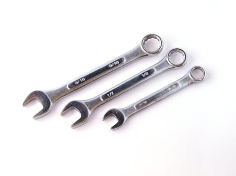 Chrome spanners on a white background.