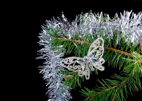 Christmas tree ornaments  on dark background .butterfly