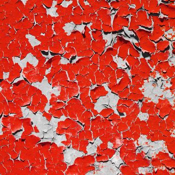 Square bright red texture peeling paint on the wall