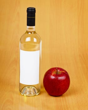 A bottle of cider on the wooden table