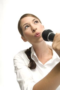 woman singing with mike and looking upwards