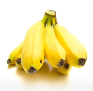 Ripe bananas on the white background