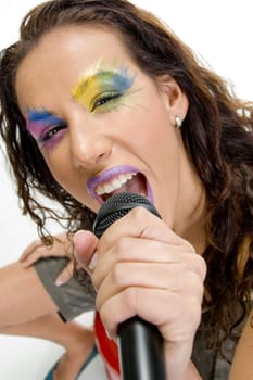 close up of woman singing into microphone