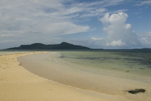 Calm Truk Lagoon waters with islands in the distance and sky.