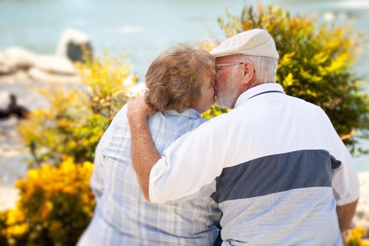 Happy Senior Couple Kissing Each Other in The Park.