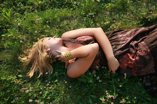 Young woman lying on the grass