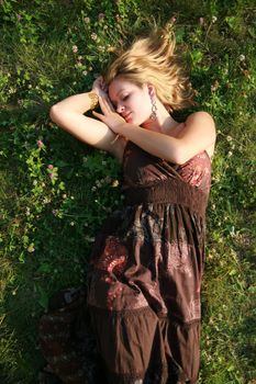 Young woman lying on the grass