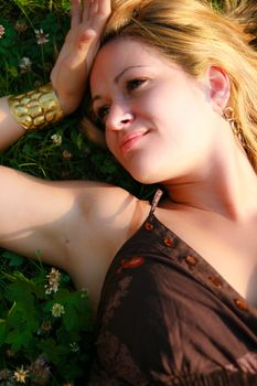 Young woman lying on the grass