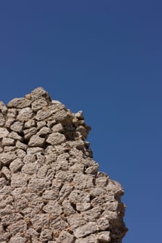 a wide shot of a broken stone wall