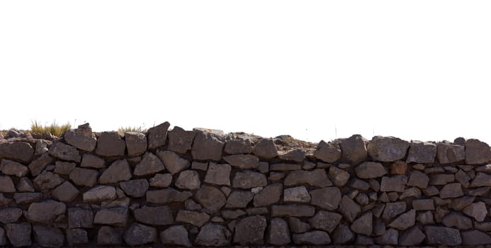 Isolated stone wall with grass on white background