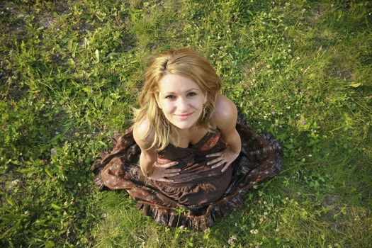 Beautiful woman lying down in summertime.