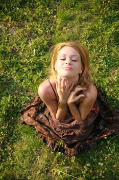 Beautiful woman lying down in summertime.