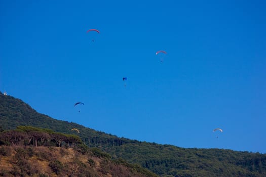 Parachutes in the sky on Albano lake (Italy)