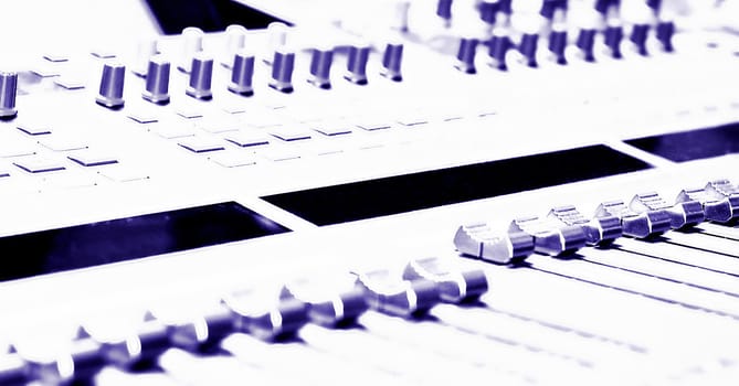 Mixing Console - high key - filtered to a blue purple monochrome