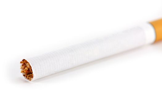 A single unlit cigarette isolated on white