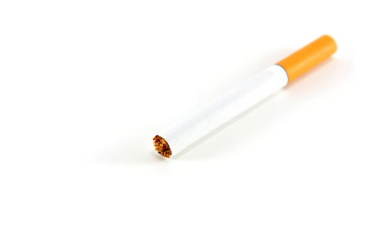 A single unlit cigarette isolated on white
