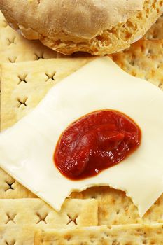 bread ,crackers and cheese with tomato sauce