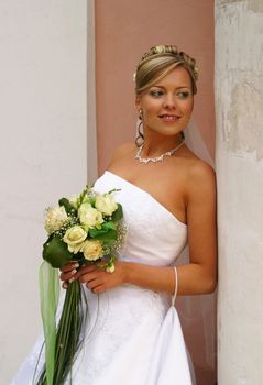 The beautiful bride with a bouquet from roses